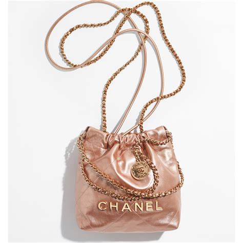 mini chanel gold bag|More.